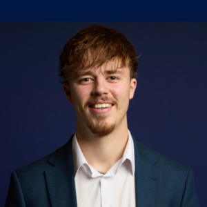 Joe Clark university admissions tutor and founder of The Degree Gap, member of The Tutor Collective, professional headshot smiling in suit jacket and white shirt.